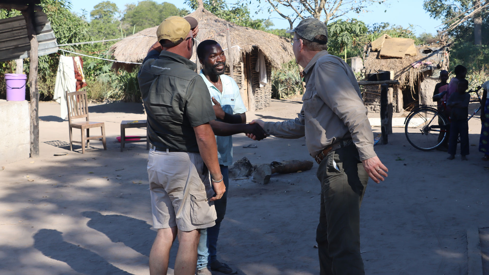 Chief Thozo's nephew greets hunters in village.